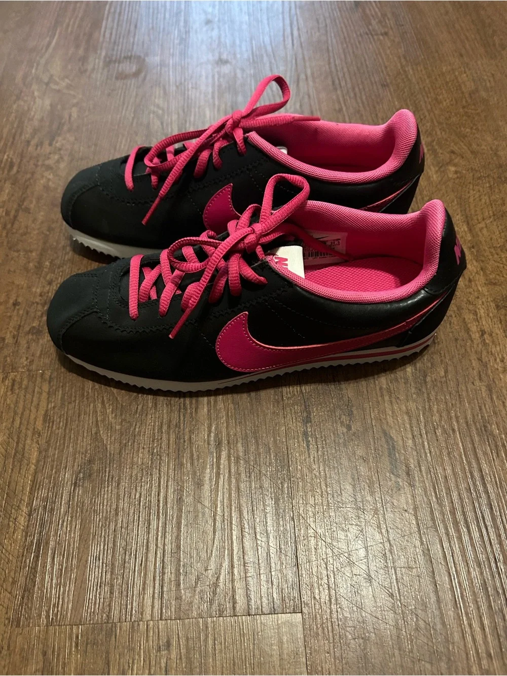 Nike Women’s Black and Hot Pink Low-Top Sneakers